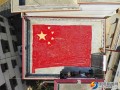 武冈六旬老农用7000个米花制成巨幅五星红旗 向国庆献礼